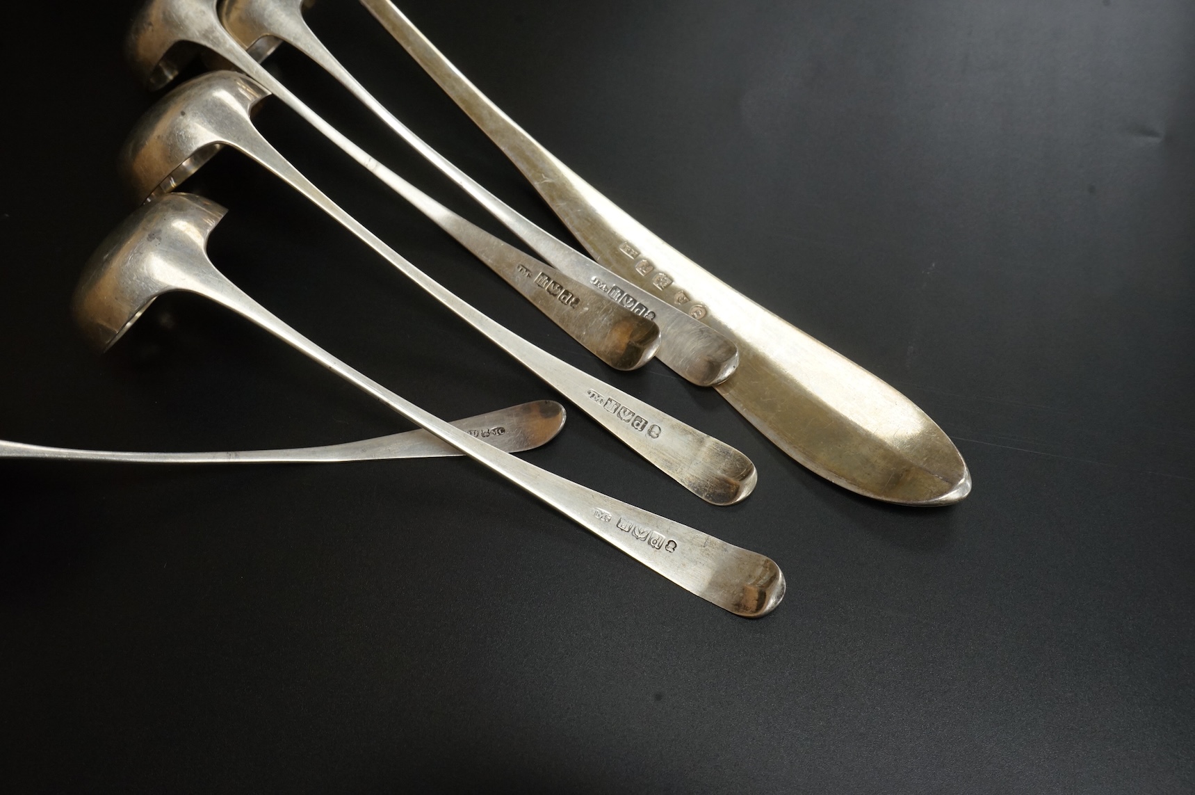 A set of four George III Scottish silver Old English pattern toddy ladles, James McKay, Edinburgh, 1809, 17.4cm, one other smaller Scottish silver ladle and a George III Scottish silver Celtic tip soup ladle, Francis How
